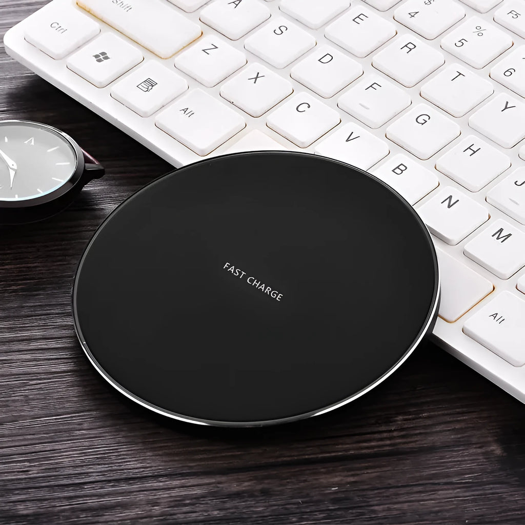 Ultra-thin square wireless charging pad in black showing smartphone charging on its surface