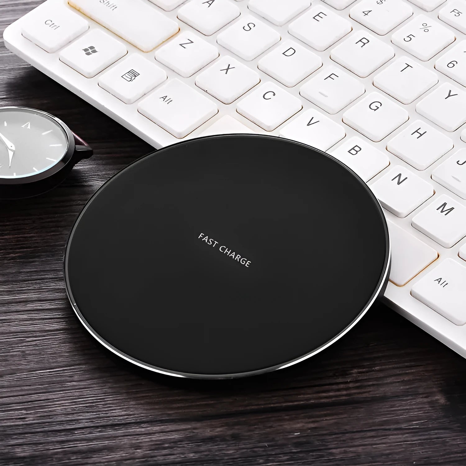 Ultra-thin square wireless charging pad in black showing smartphone charging on its surface