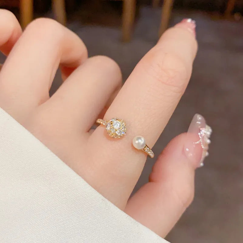 Round zircon open-end pearl ring in gold or silver colour with thick real gold plating over copper