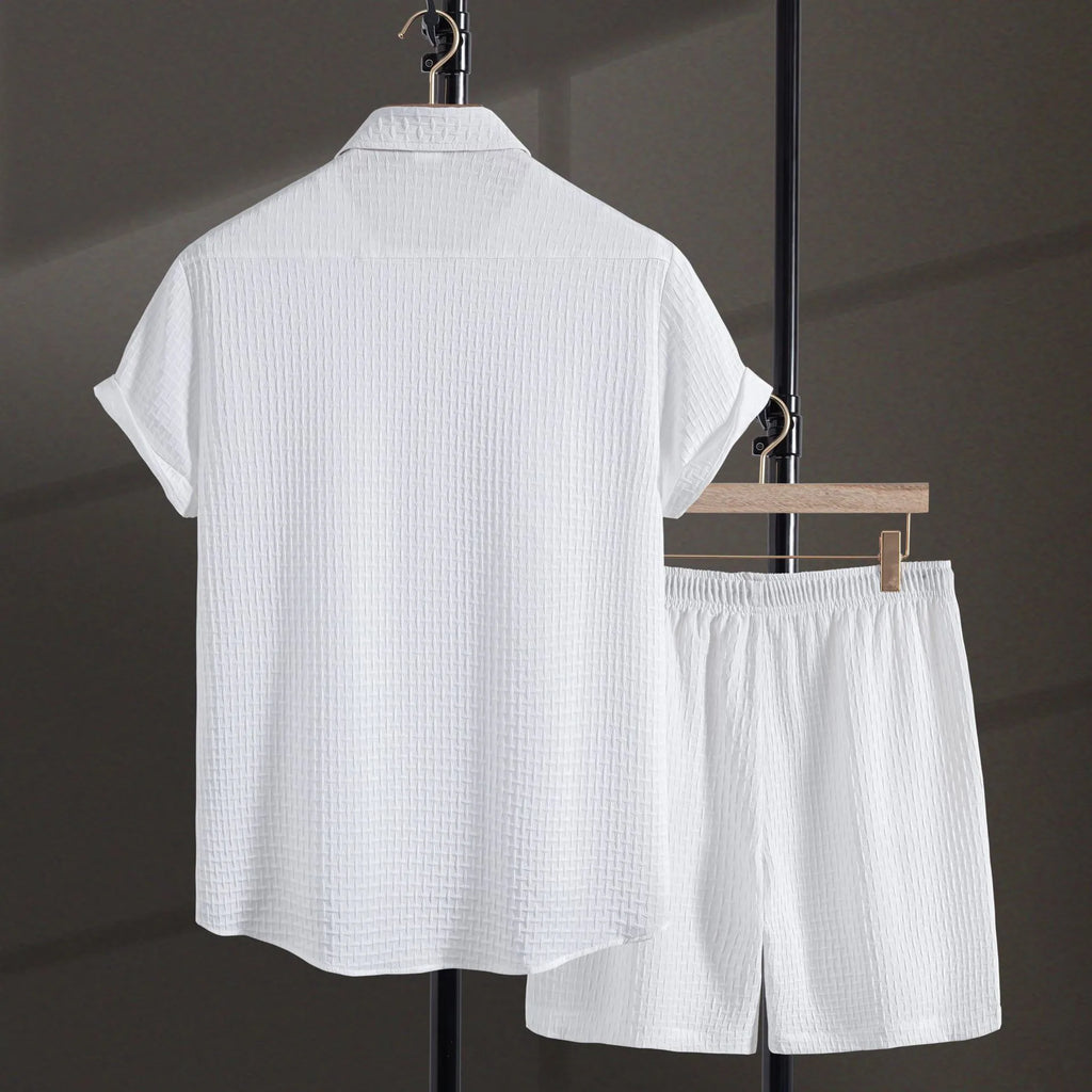 Men's loose fit cotton blend beach suit with short sleeve shirt and shorts in white.