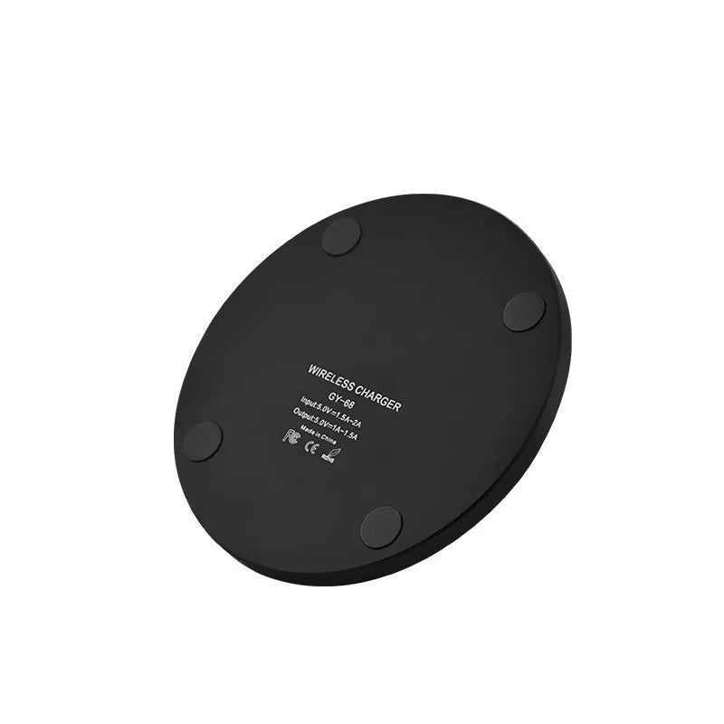 Ultra-thin square wireless charging pad in black showing smartphone charging on its surface