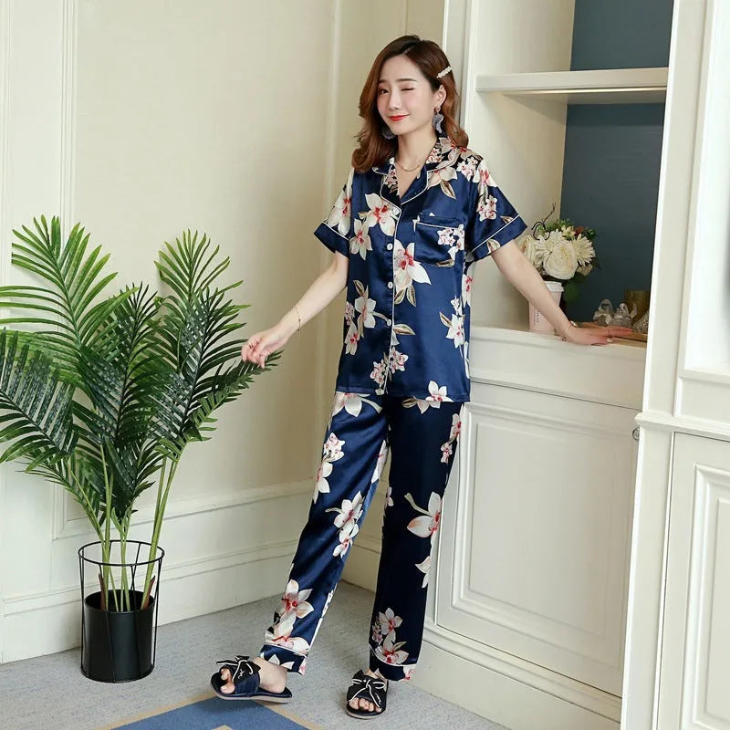Women's two-piece short-sleeved pyjama set in begonia print with trousers, shown on a model