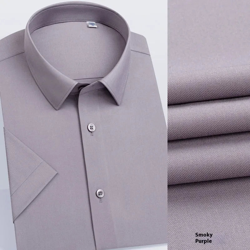 Man wearing a light blue long-sleeved non-iron business casual shirt with a regular fit.