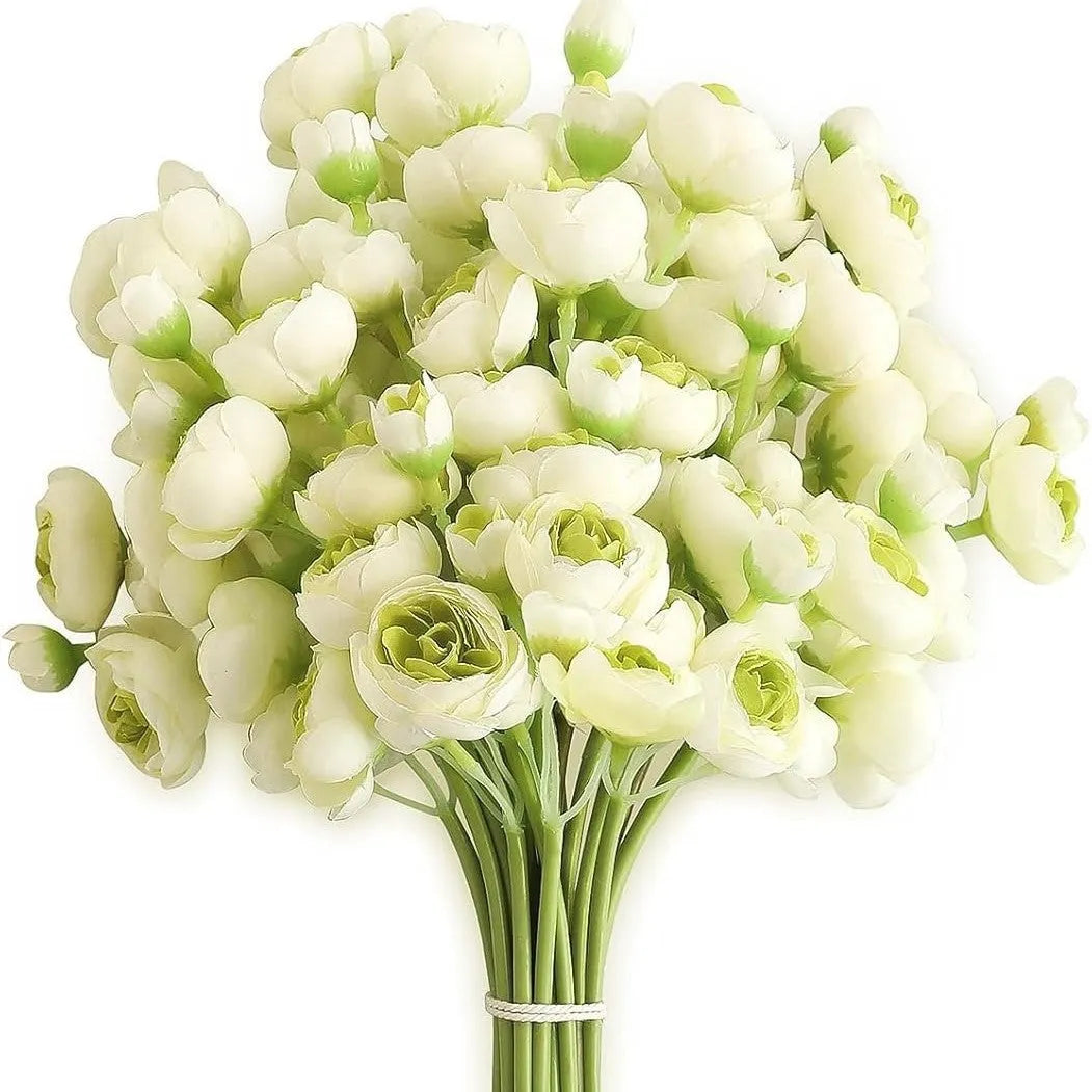 Simulation mini bridal bouquet with silk flowers in white on a table for home decoration