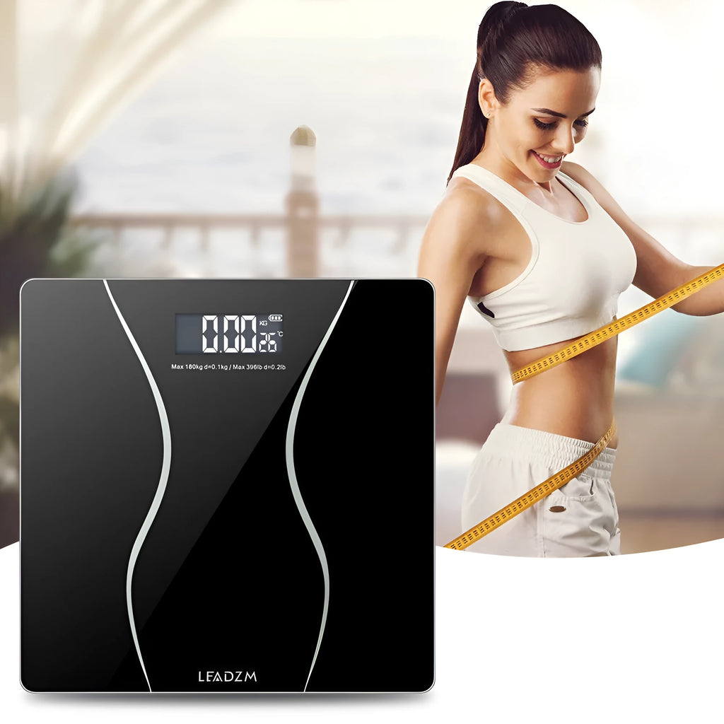 Black electronic bathroom scale with digital display for weight measurement up to 180 kg.