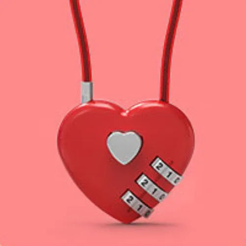 Peach Heart shaped wire rope lock in ABS plastic for securing bicycle helmets.