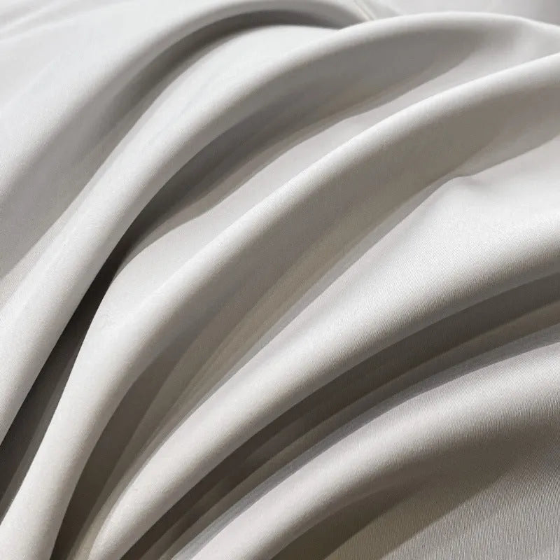 Pure cotton four-piece bedding set with embroidered details, available in dove gray, ruifen, or xingyao blue, for 1.5m or 1.8m bed