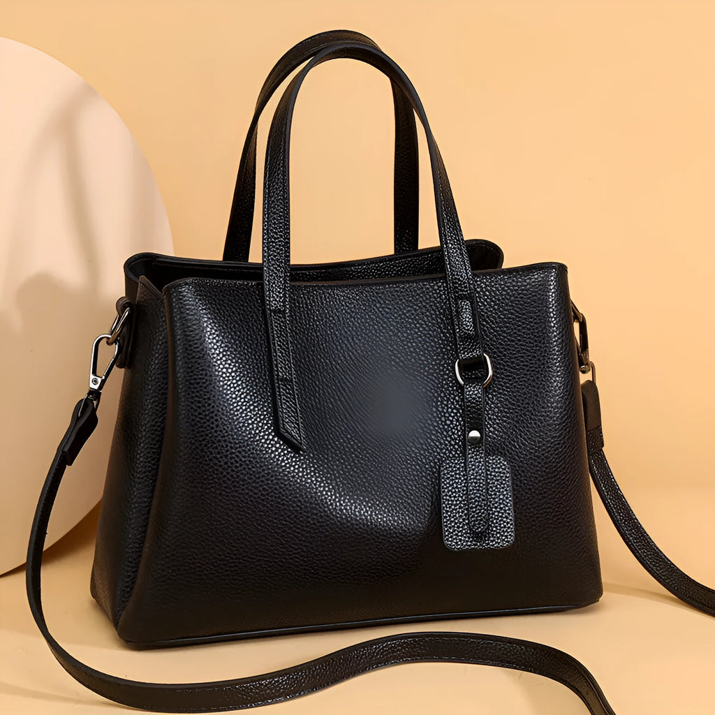 Genuine cowhide leather women's handbag in horizontal square shape with shoulder strap and organisational compartments