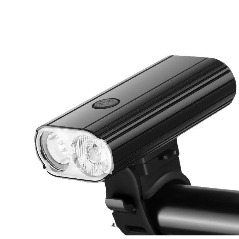 Black bicycle headlight with USB Type-C charging port and aluminium alloy body mounted on handlebars