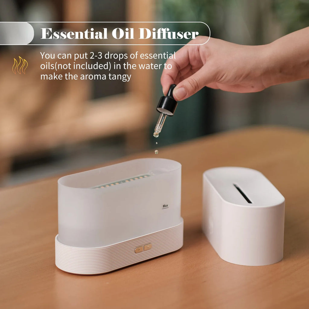 Ultrasonic aroma diffuser with flame light, black, 75x75x137mm, on wooden table with mist