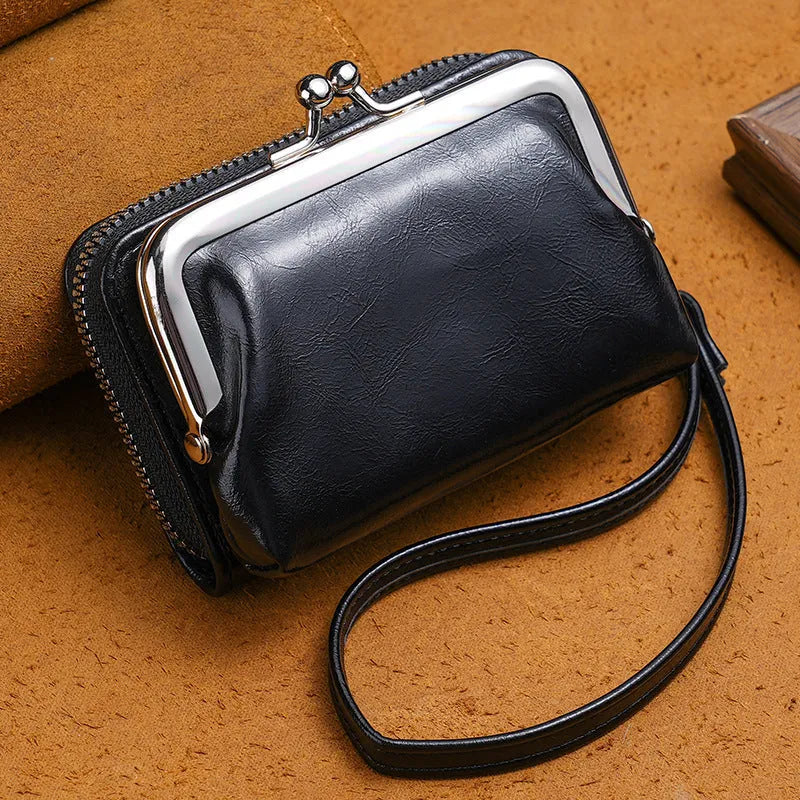Ladies' leather-look coin purse with a 4-inch metal clip and zip closure in five colour options.