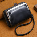 Ladies' leather-look coin purse with a 4-inch metal clip and zip closure in five colour options.