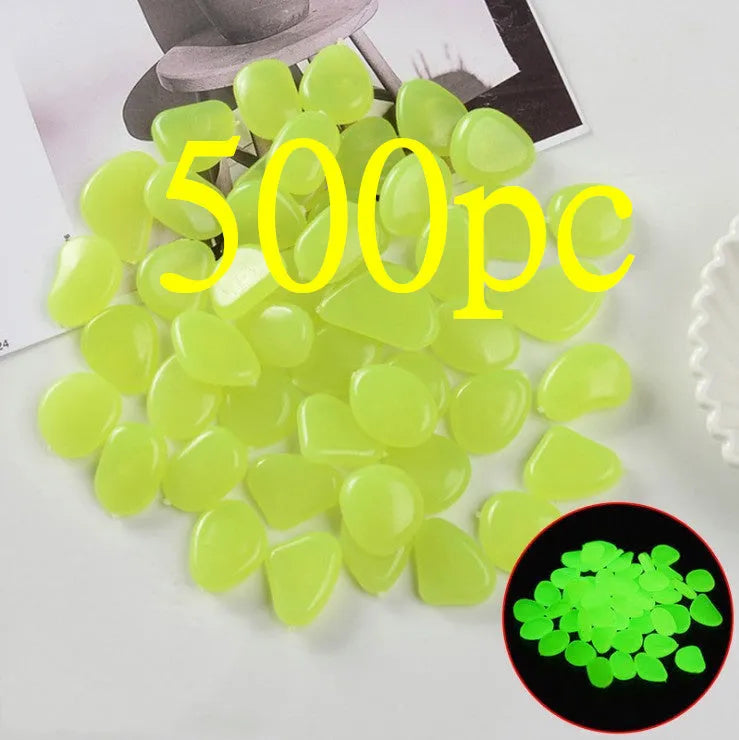 Luminous fluorescent aquarium and garden pebbles in mixed colours including dark purple, yellow, light blue, pink, orange