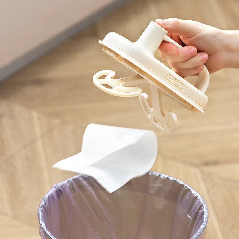 Disposable Magic Brush cleaning tool with plastic handle and stack of 50 white non-woven fabric refill rags.