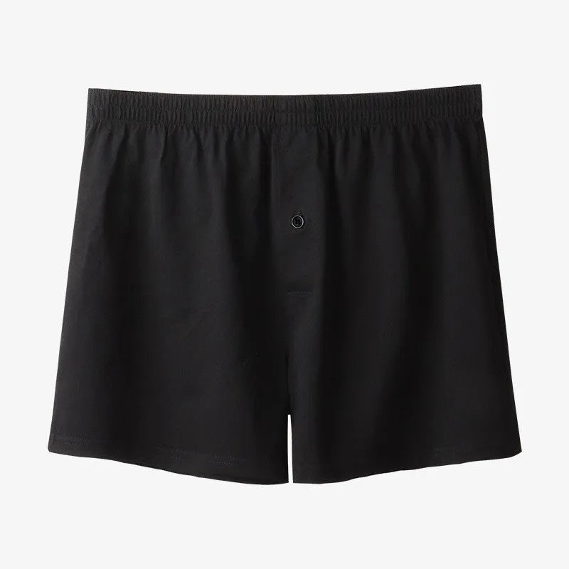 Men's solid colour cotton boxer shorts on a white background, showing loose fit and high waistband.
