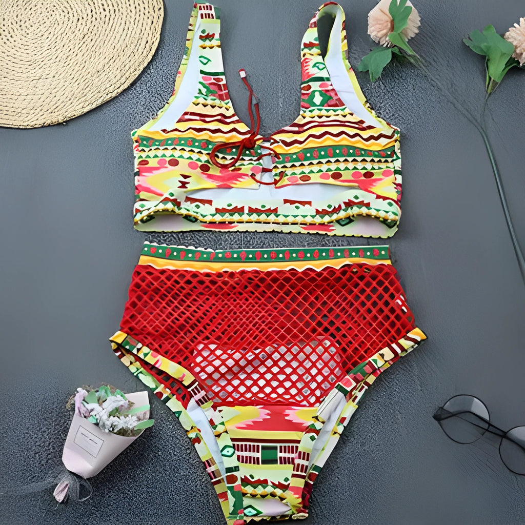 Women's multicolour checkered bikini set with cross-strap bra and high-waist fishnet briefs on a neutral background.