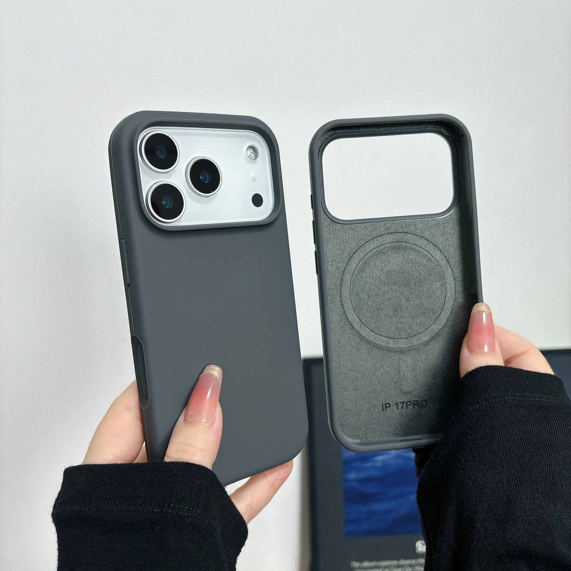 Liquid silicone magnetic iPhone case with Ai button in antique white colour on a table.