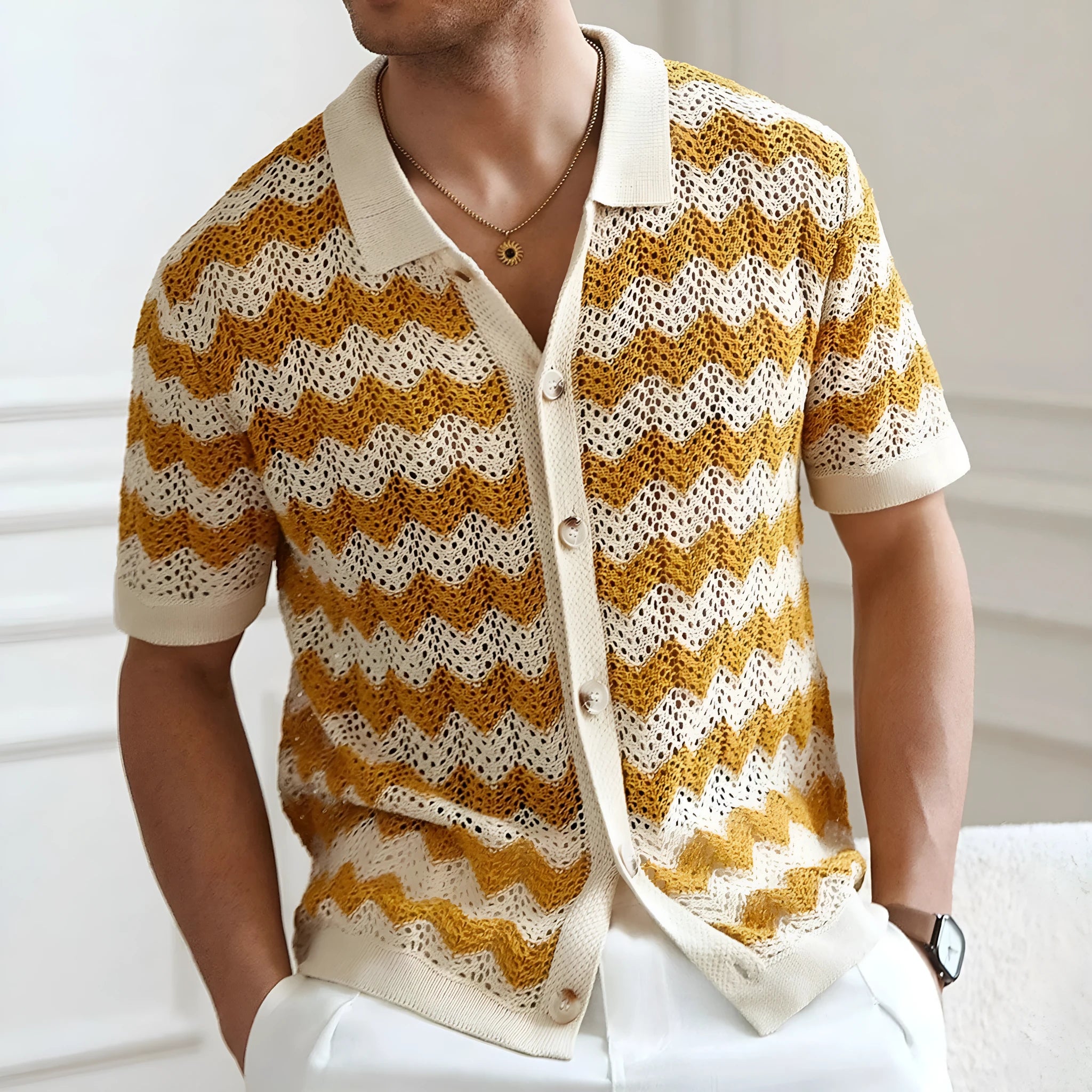 Blue hollow jacquard corrugated short sleeve sweater with flocked detail on a hanger.
