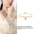 S925 sterling silver cherry blossom pendant with gradient pink epoxy on Hetian jade beaded bracelet