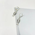 Retro fishbone pendant necklace and earrings set with adjustable alloy chain on a white background