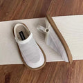 Breathable linen slip-on shoes with mesh lining and rubber soles in milky white colour