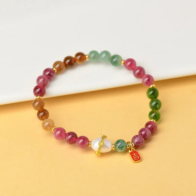 Geometric unisex bracelet made from chalcedony and tourmaline crystals, bead size 6.5mm.