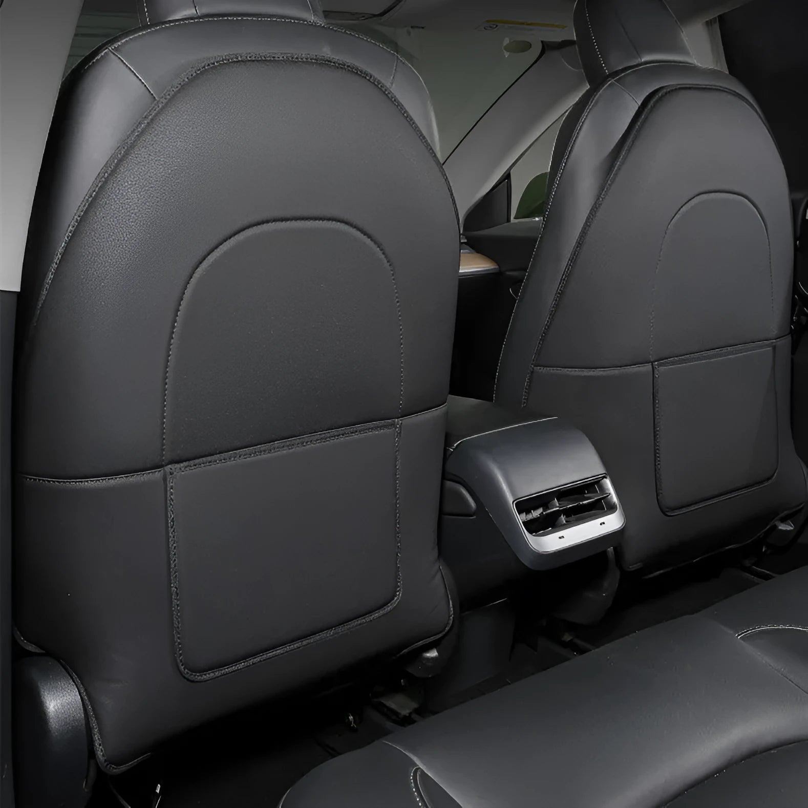 Two black leather rear anti kick pads for car seats, showing size and single pocket.