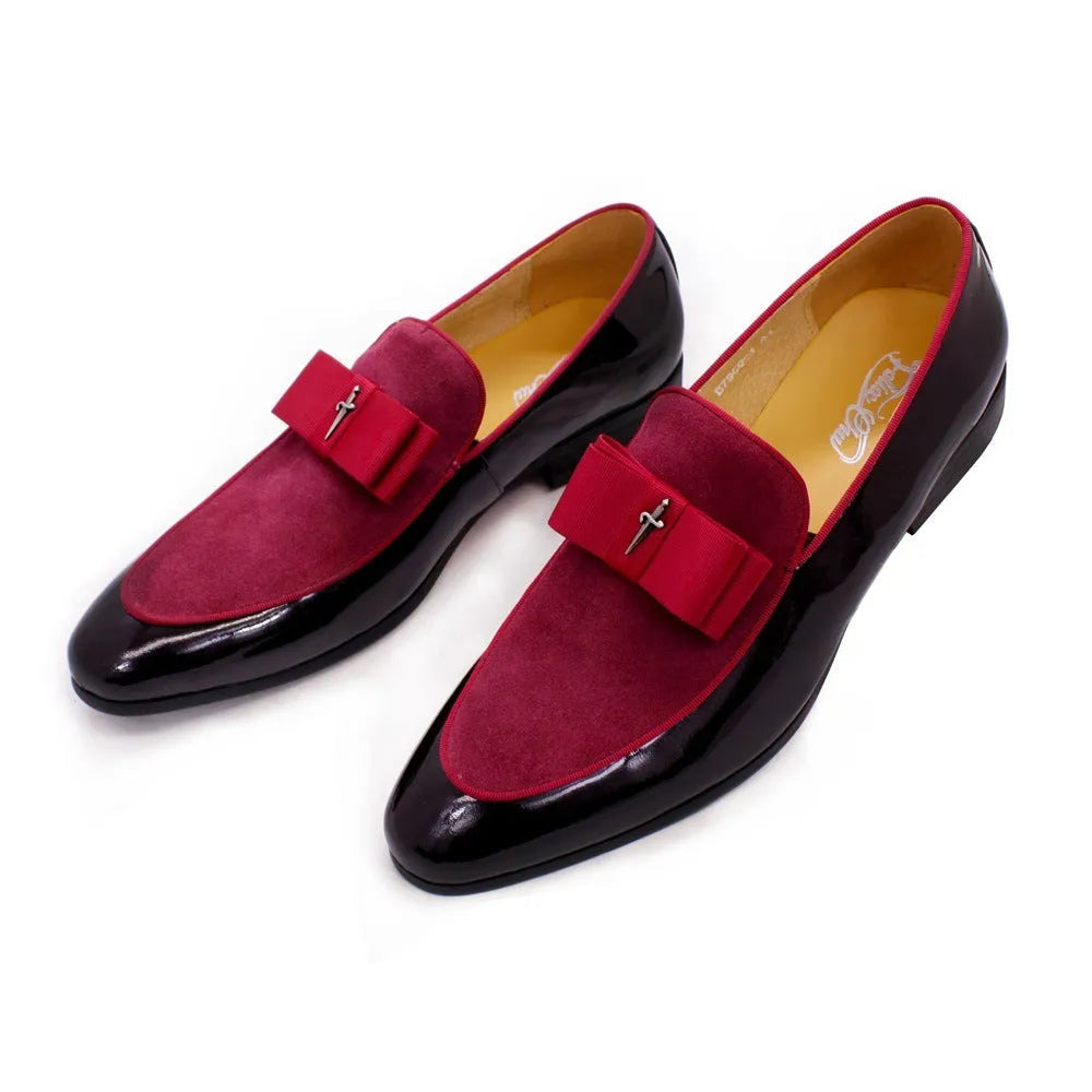 Men's glossy black patent leather low-top shoes with a tassel detail on a white background.