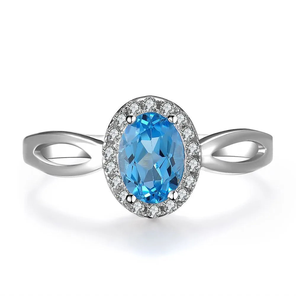 925 Sterling Silver four-piece jewellery set with Blue Topaz gemstones including earrings, ring, pendant and necklace