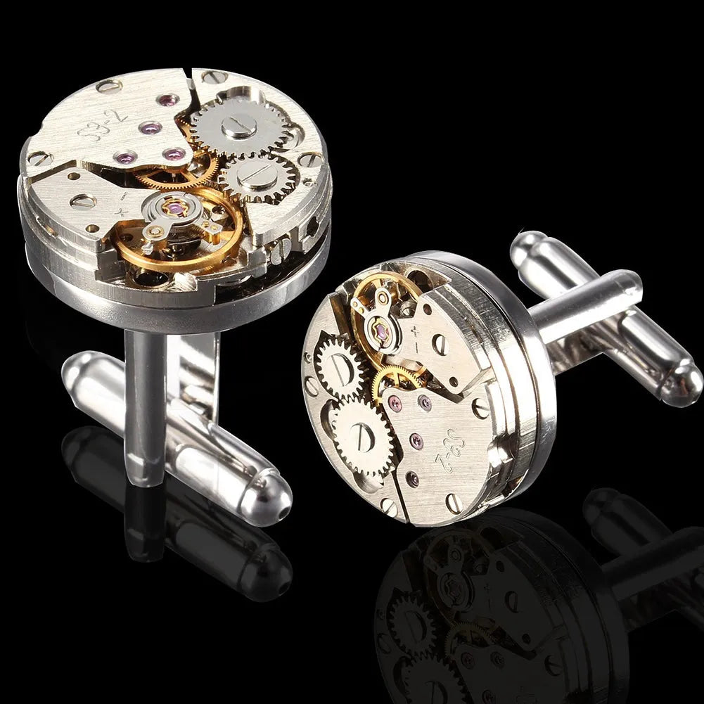 Silver geometric men's cufflinks with copper body and mechanical watch movement on dress shirt cuff