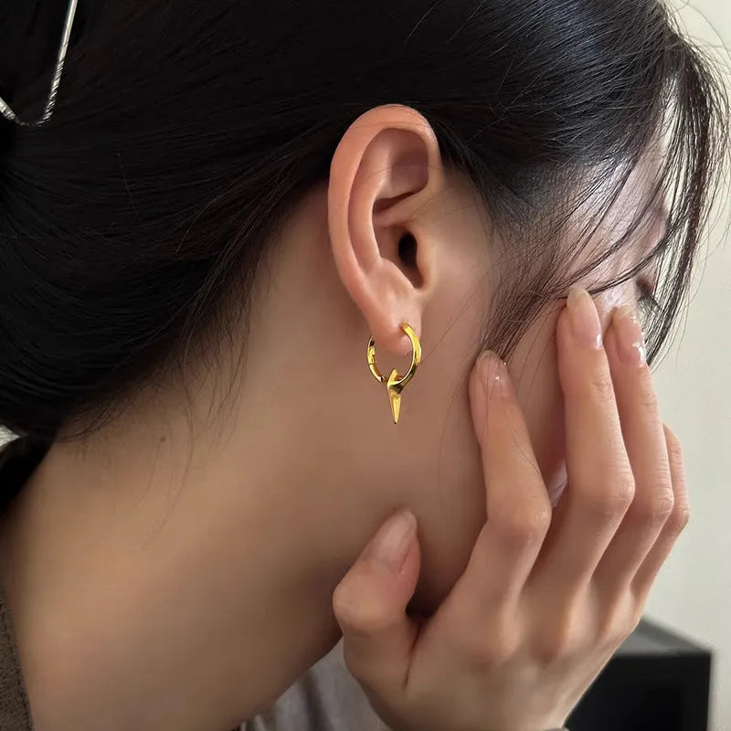 Geometric star stud earrings for women with white gold plated finish on copper.
