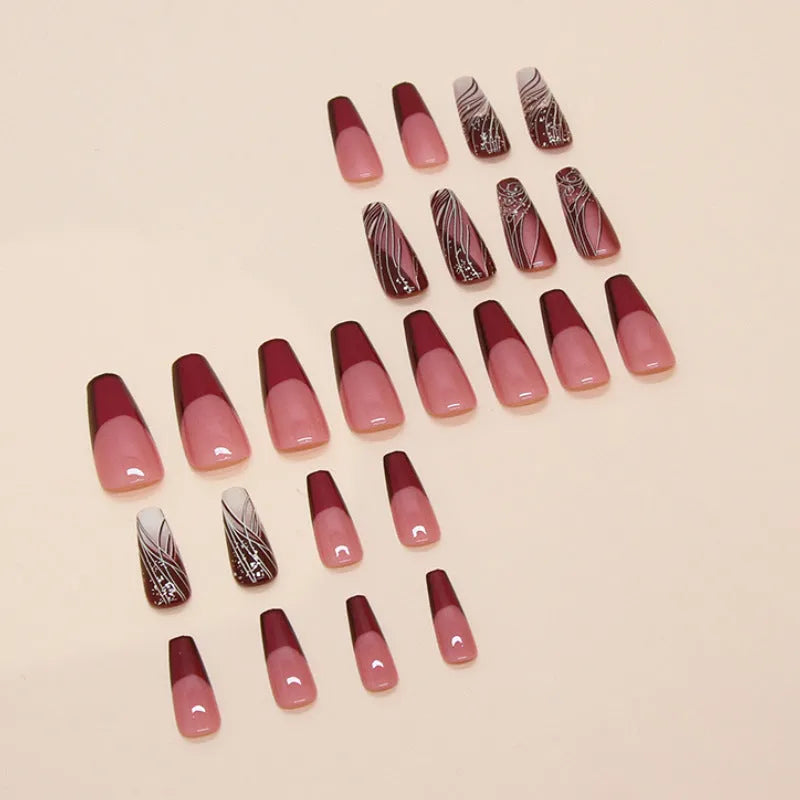 French line patterned removable nail sticker patches and glue tube on white background.