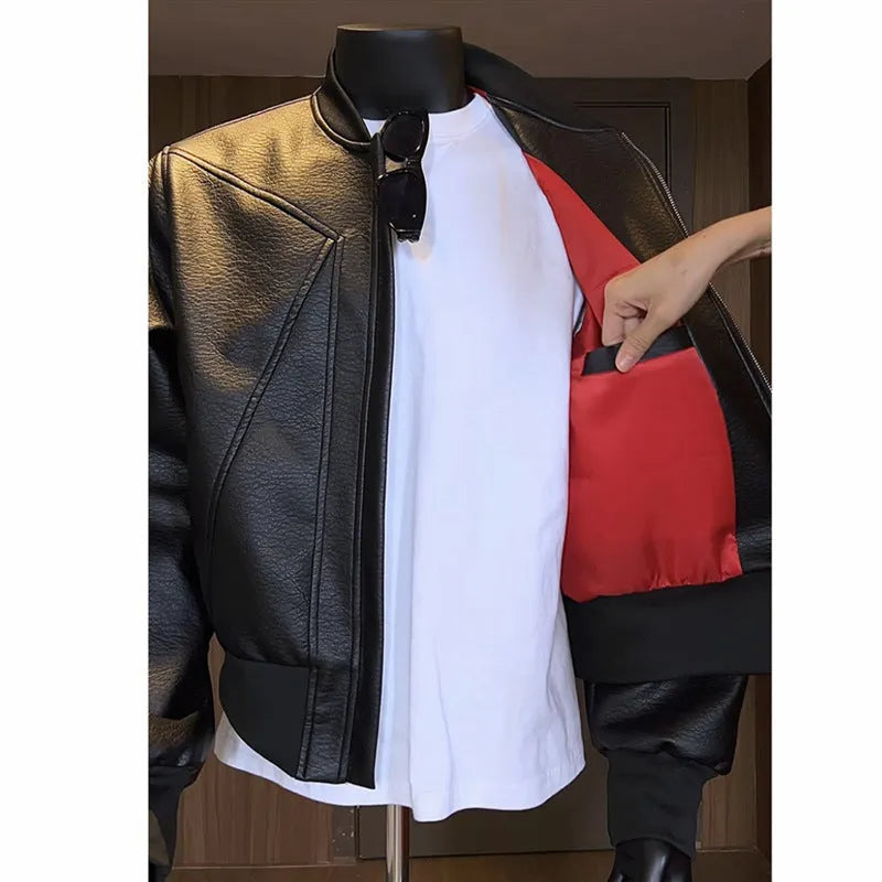 Men's black fitted PU leather jacket with litchi grain texture and 100cm extended length.