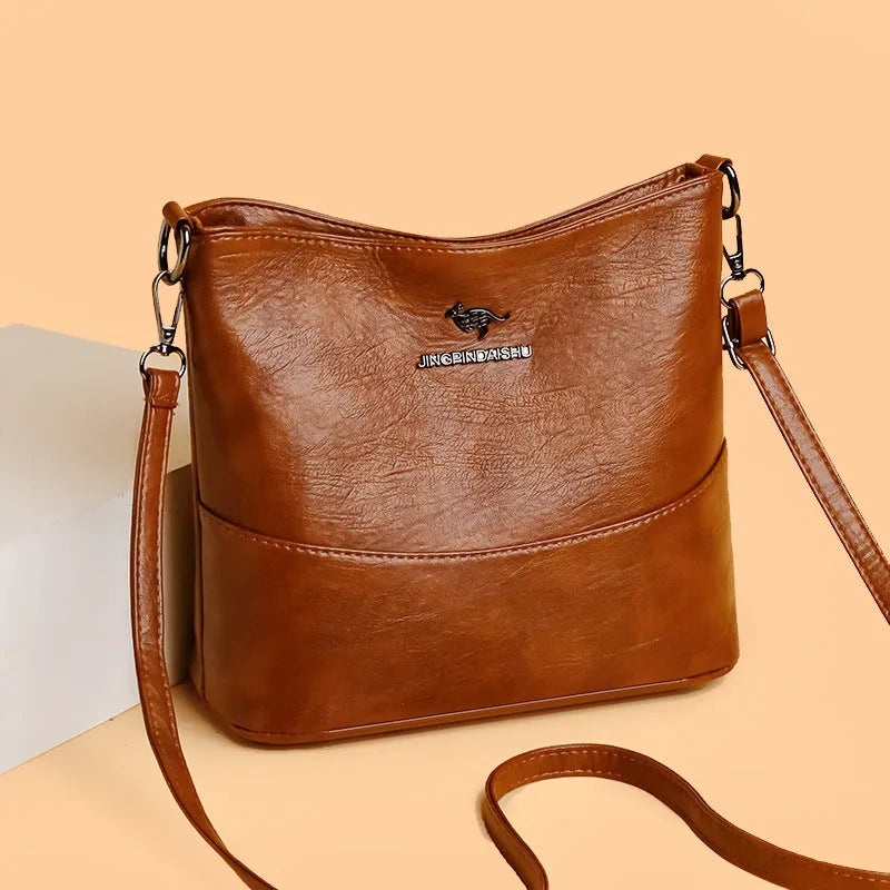 Women's soft leather large capacity shoulder bag in bucket design with internal organisation