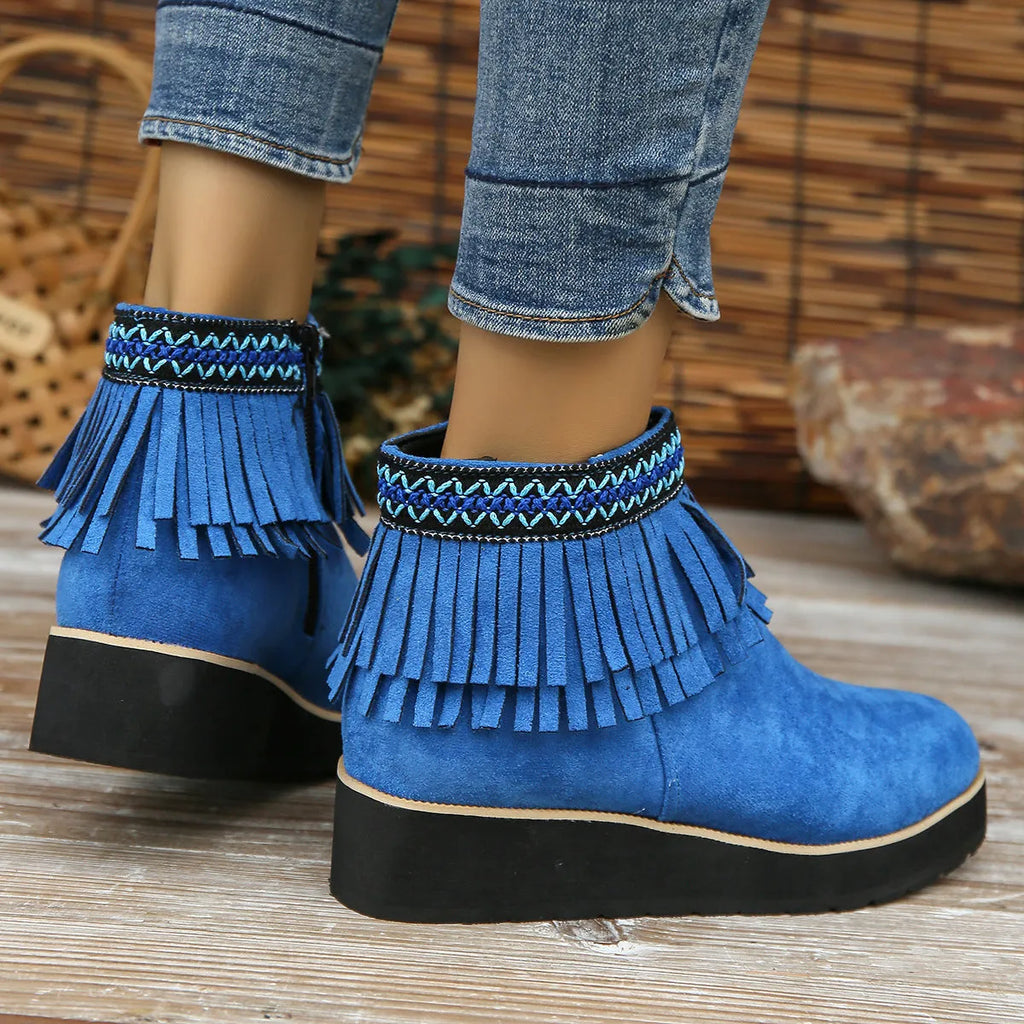 Women's suede wedge ankle boots with side zipper, thick rubber sole, and tassel detailing in dark brown colour