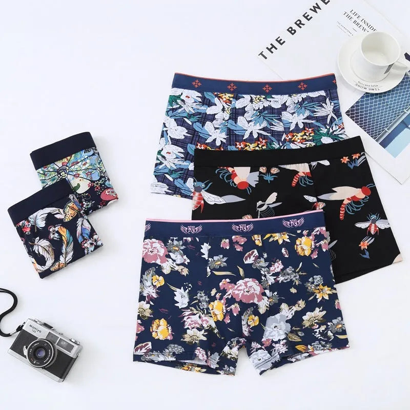 Men's floral print cotton boxer shorts showing the U-shaped pouch design and available colour variations.
