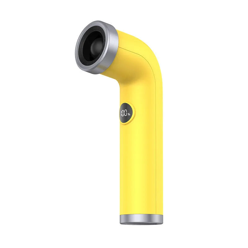 A compact apricot, pink, or yellow bladeless turbine fan on a desk.