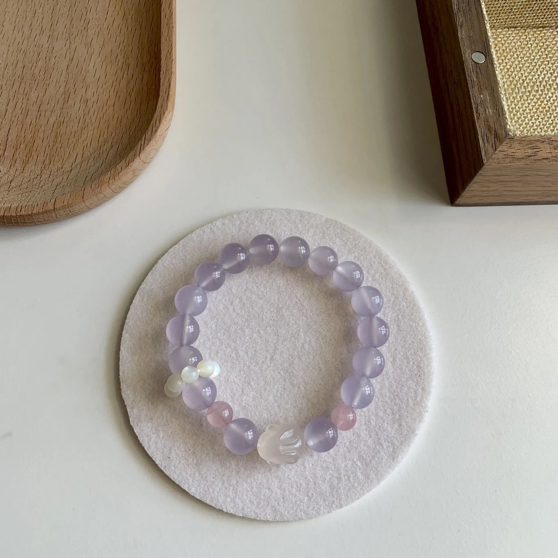 Handmade women's Hetian Jade Rabbit bracelet with glass rabbit charms in a gift box.