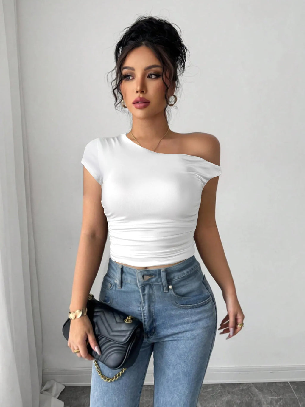 Women's white polyester slim fit top with oblique shoulder neckline and raglan sleeves