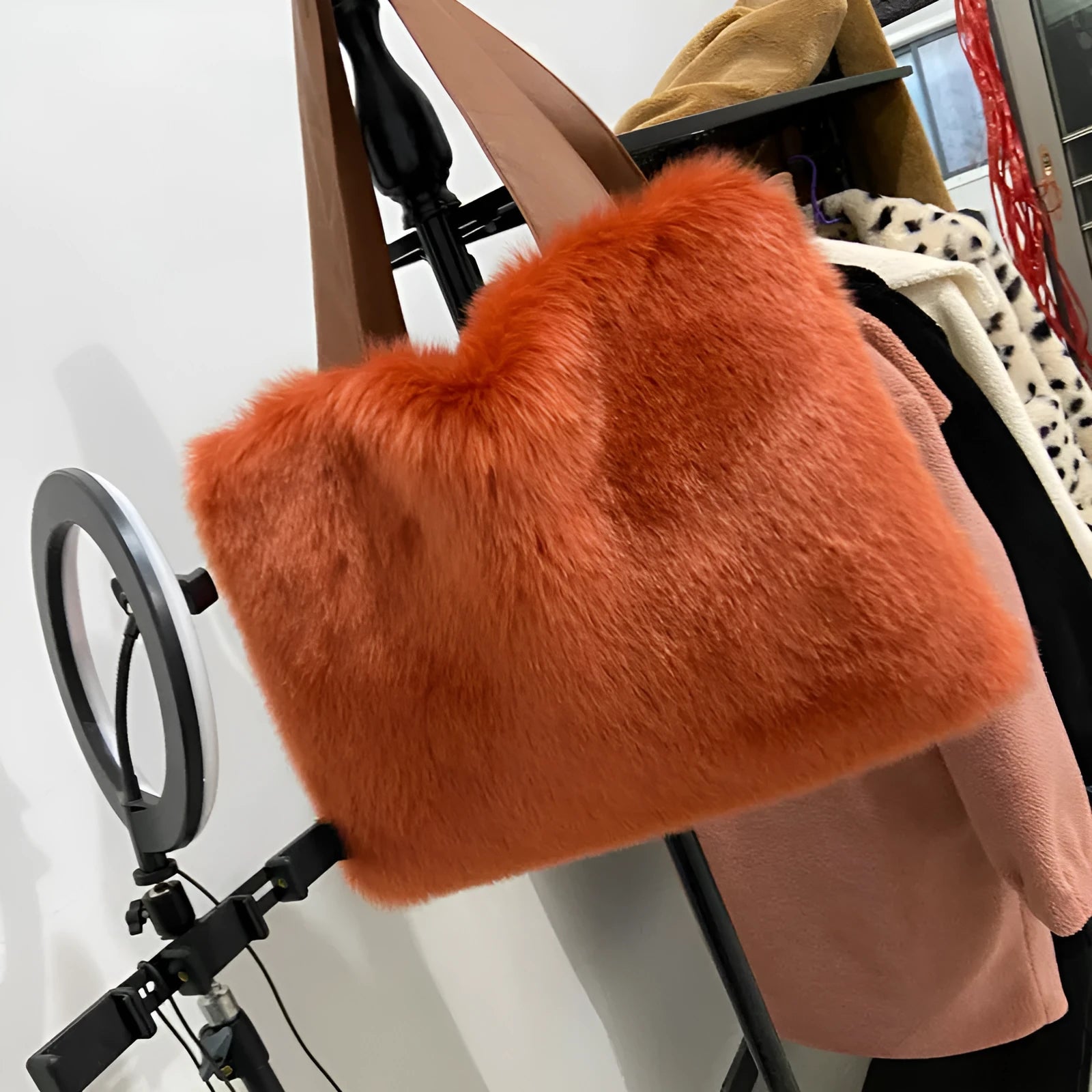 Large women's imitation fur shoulder bag in black, horizontal square shape with double straps and zipper closure