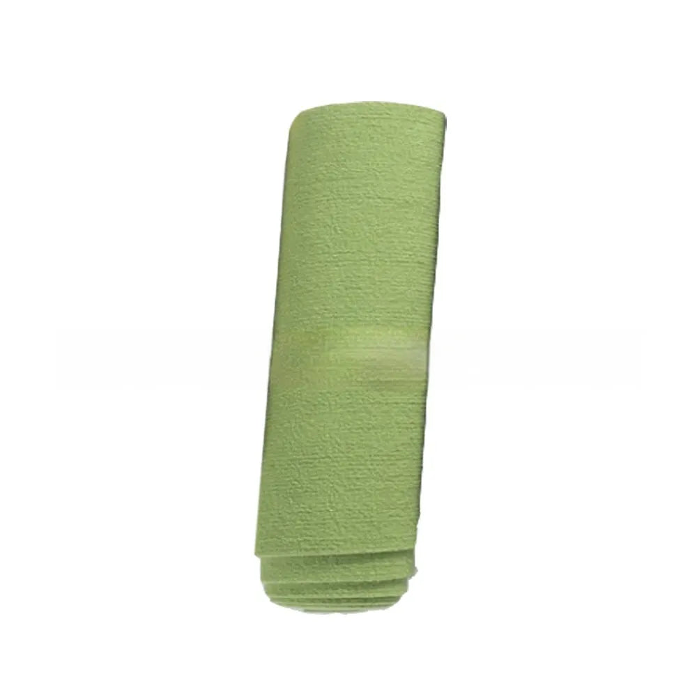 Self-adhesive cat scratch carpet mat in beige, trimmed to fit sofa arm, with scissors and roll packaging