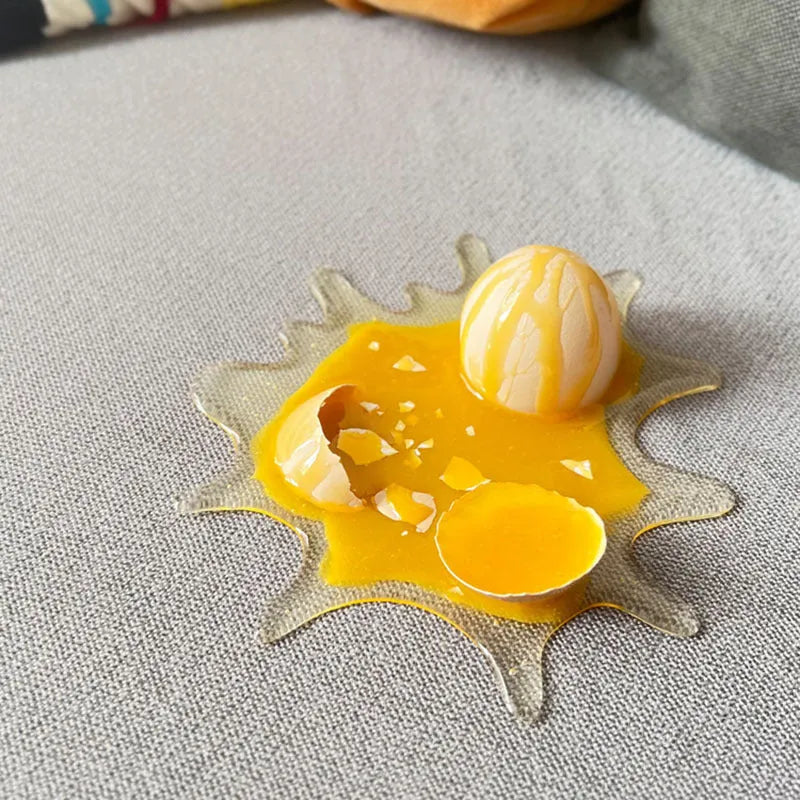 Broken egg shaped decompression toy mobile phone holder measuring 15x17cm in broken egg colour