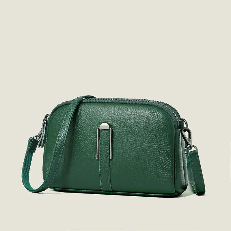 Minimalist crossbody bag in top-grain leather, horizontal square shape, available in five colours including khaki and black