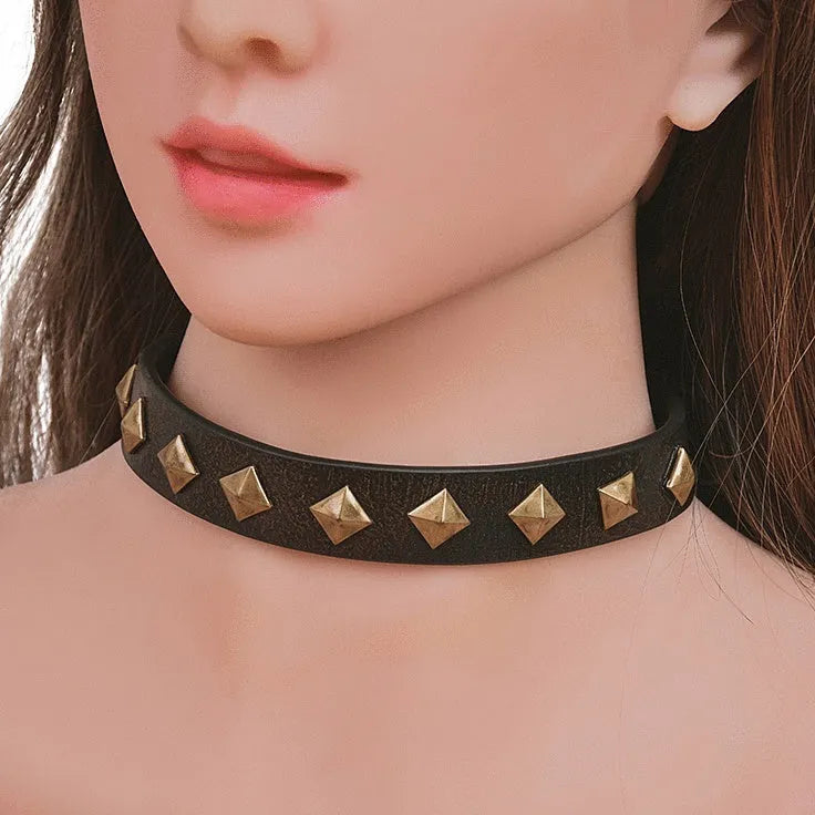 Bronze rivet cowhide leather punk collar with buckle closure on display