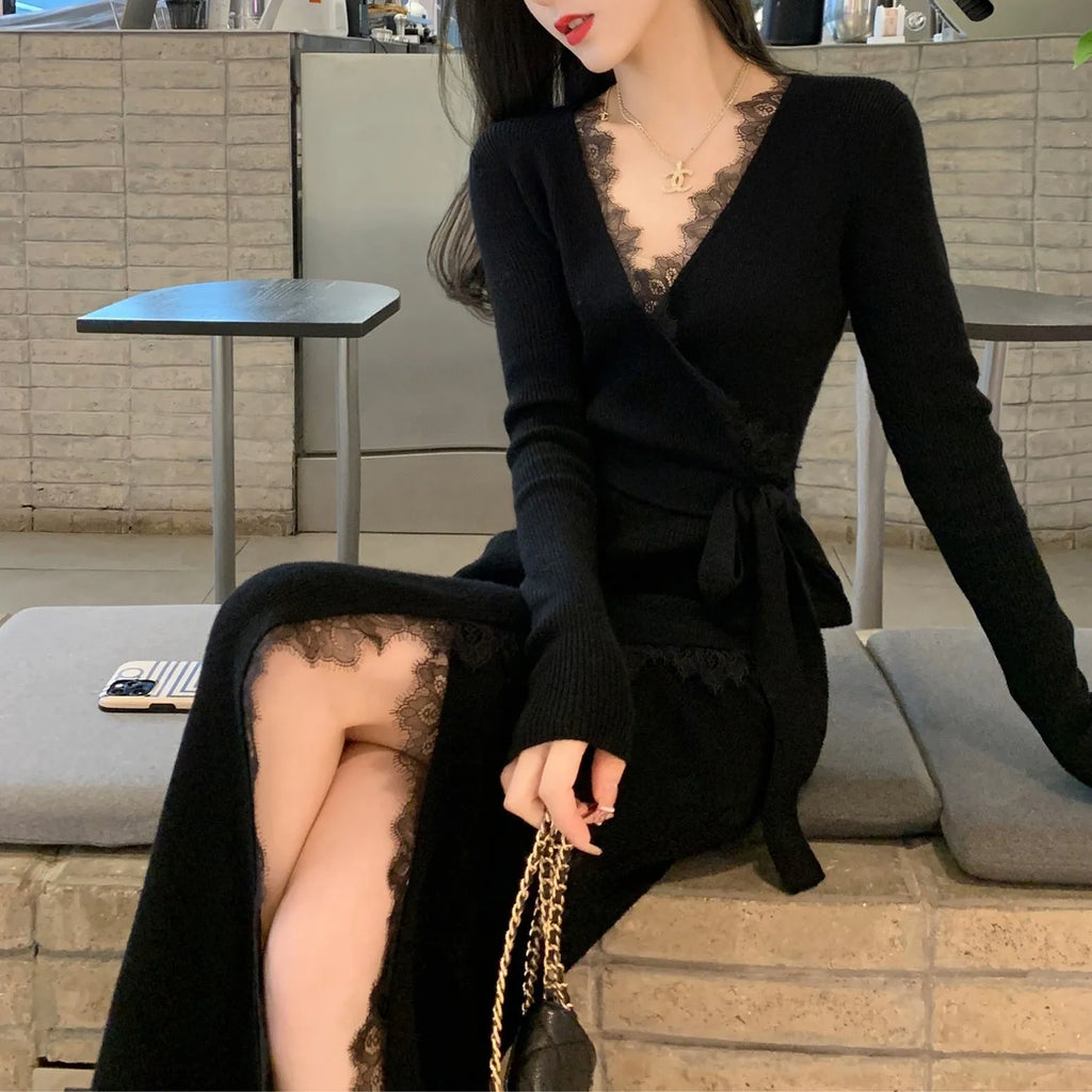 Black slim fit wool skirt dress with a princess A-line silhouette on a hanger.