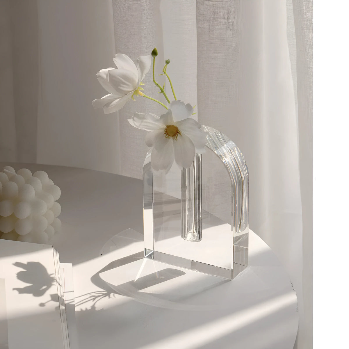 Transparent crystal vase with solidified bubble patterns on a simple modern background