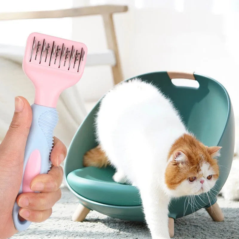 Pink stainless steel dog comb with integrated knot cutting blade for pet grooming