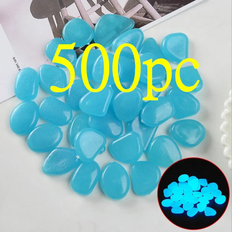 Luminous fluorescent aquarium and garden pebbles in mixed colours including dark purple, yellow, light blue, pink, orange