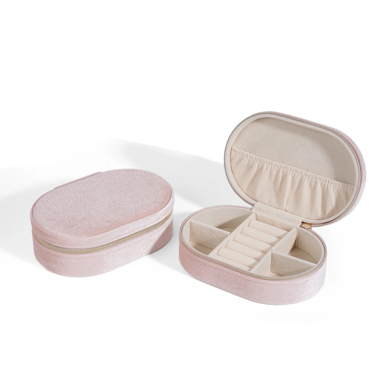 Oval velvet jewellery storage box in multiple colours with flannel lining, showing compact 15x10x5 cm size.