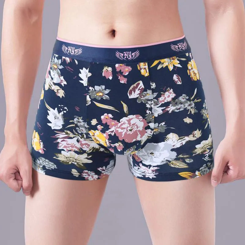 Men's floral print cotton boxer shorts showing the U-shaped pouch design and available colour variations.
